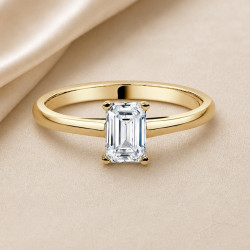 Solitario esmeralda oro amarillo · diamante natural 0,70 ct