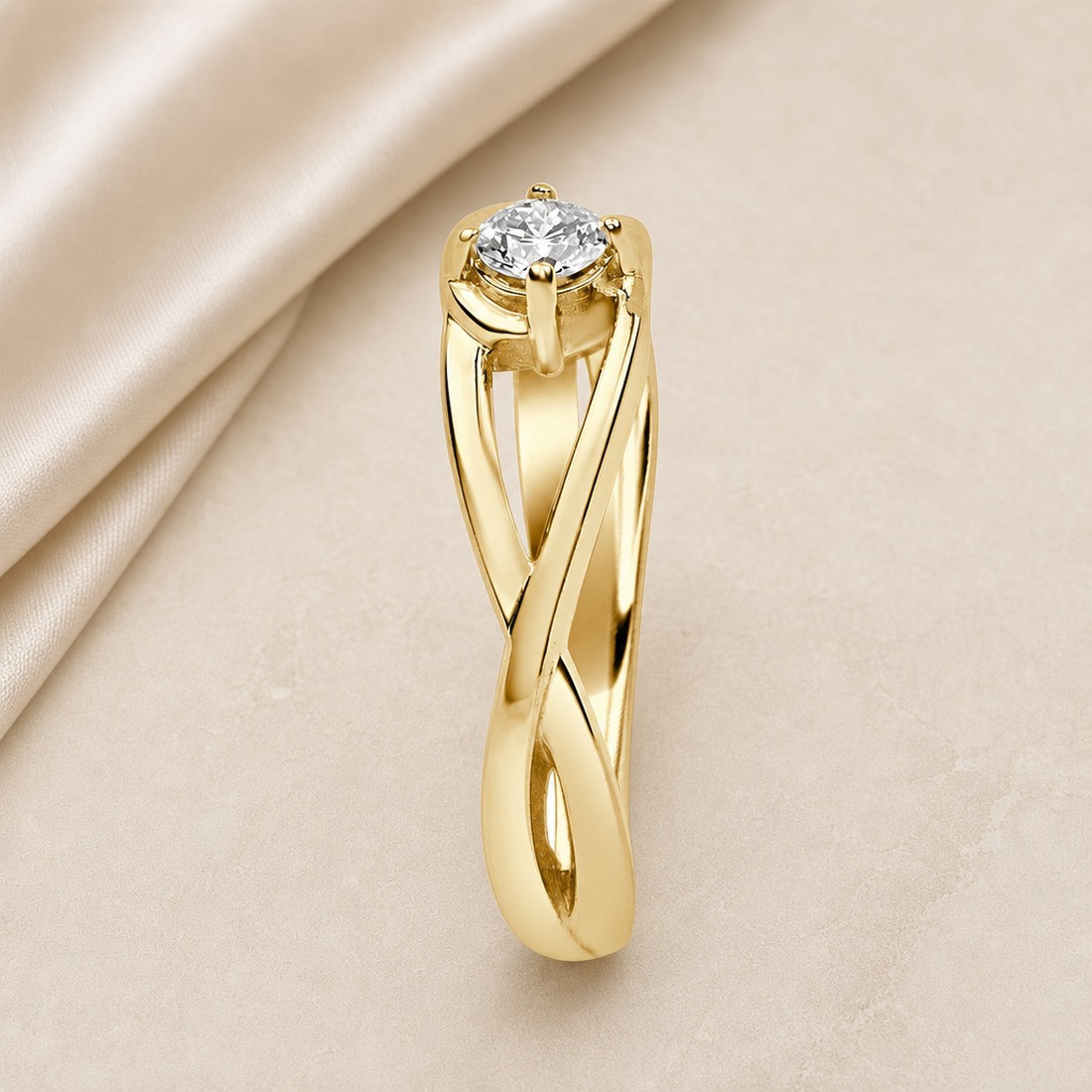 Solitario oro amarillo de diseño infinito · perfil del brazo entrelazado, diamante natural 0,15 ct | Joyería Bellido