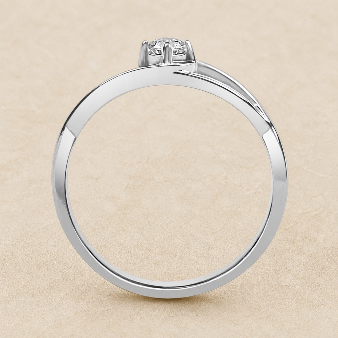 Solitario oro blanco de diseño infinito · perfil del engaste, diamante natural 0,15 ct | Joyería Bellido
