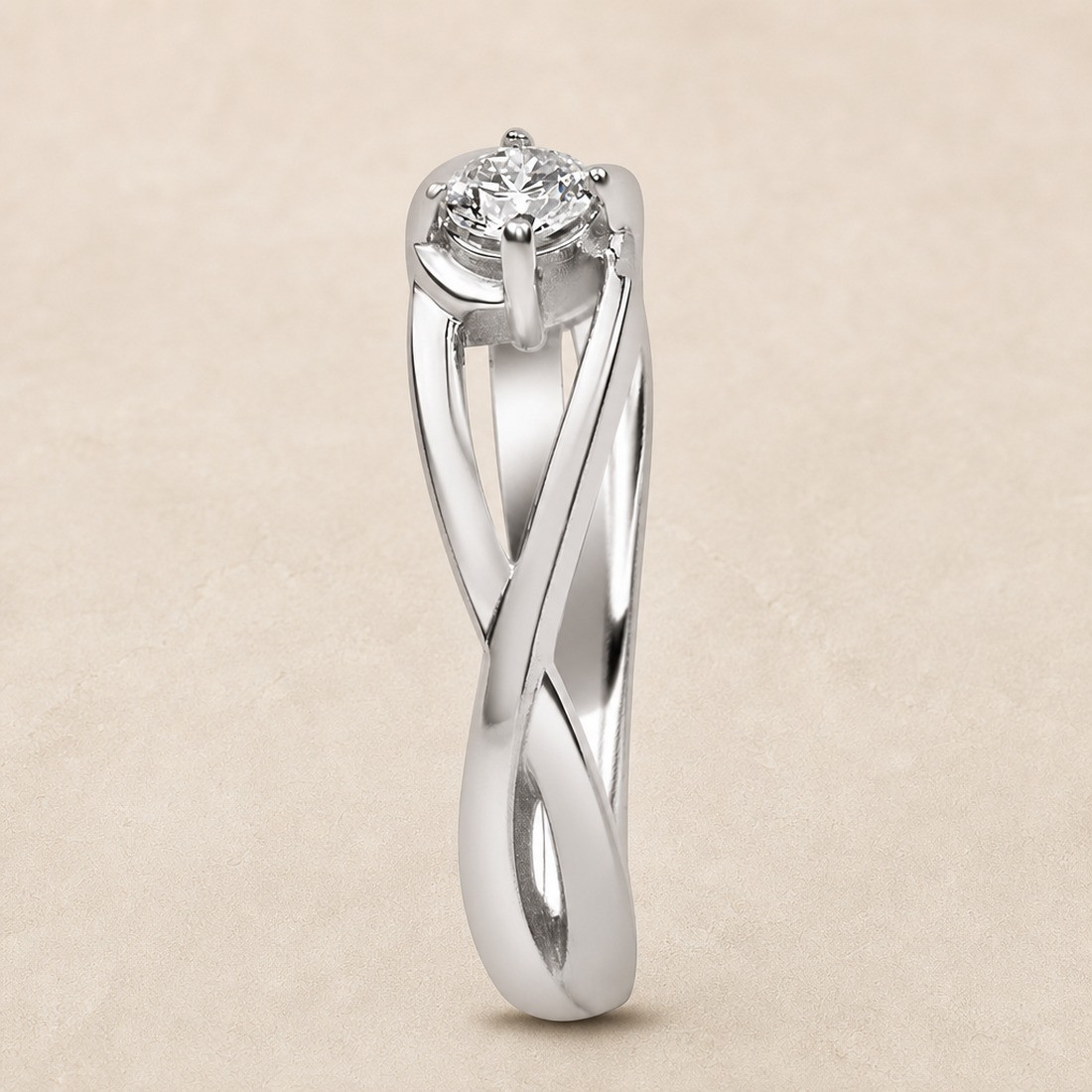 Solitario oro blanco de diseño infinito · perfil del brazo entrelazado, diamante natural 0,15 ct | Joyería Bellido