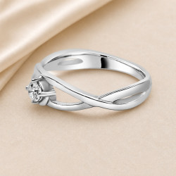 Solitario oro blanco de diseño infinito · detalle del brazo entrelazado, diamante natural 0,15 ct | Joyería Bellido