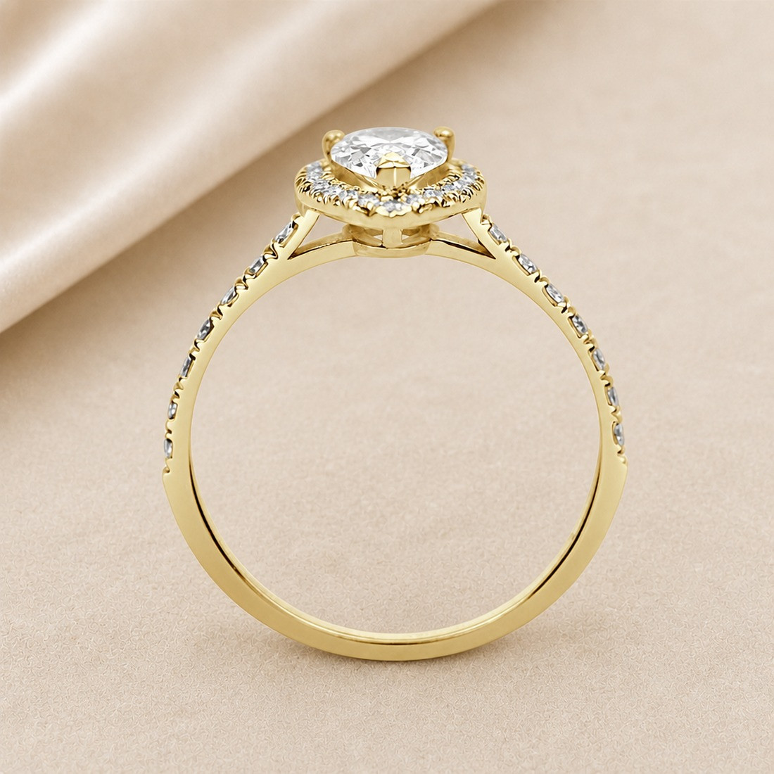 Solitario oro amarillo halo de talla pera · perfil del engaste, diamante natural 0,70 ct | Joyería Bellido